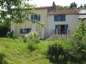 The house seen from the garden - two comfortable gites with a large garden, pool and huge views, in the heart of the french Auvergne region. 